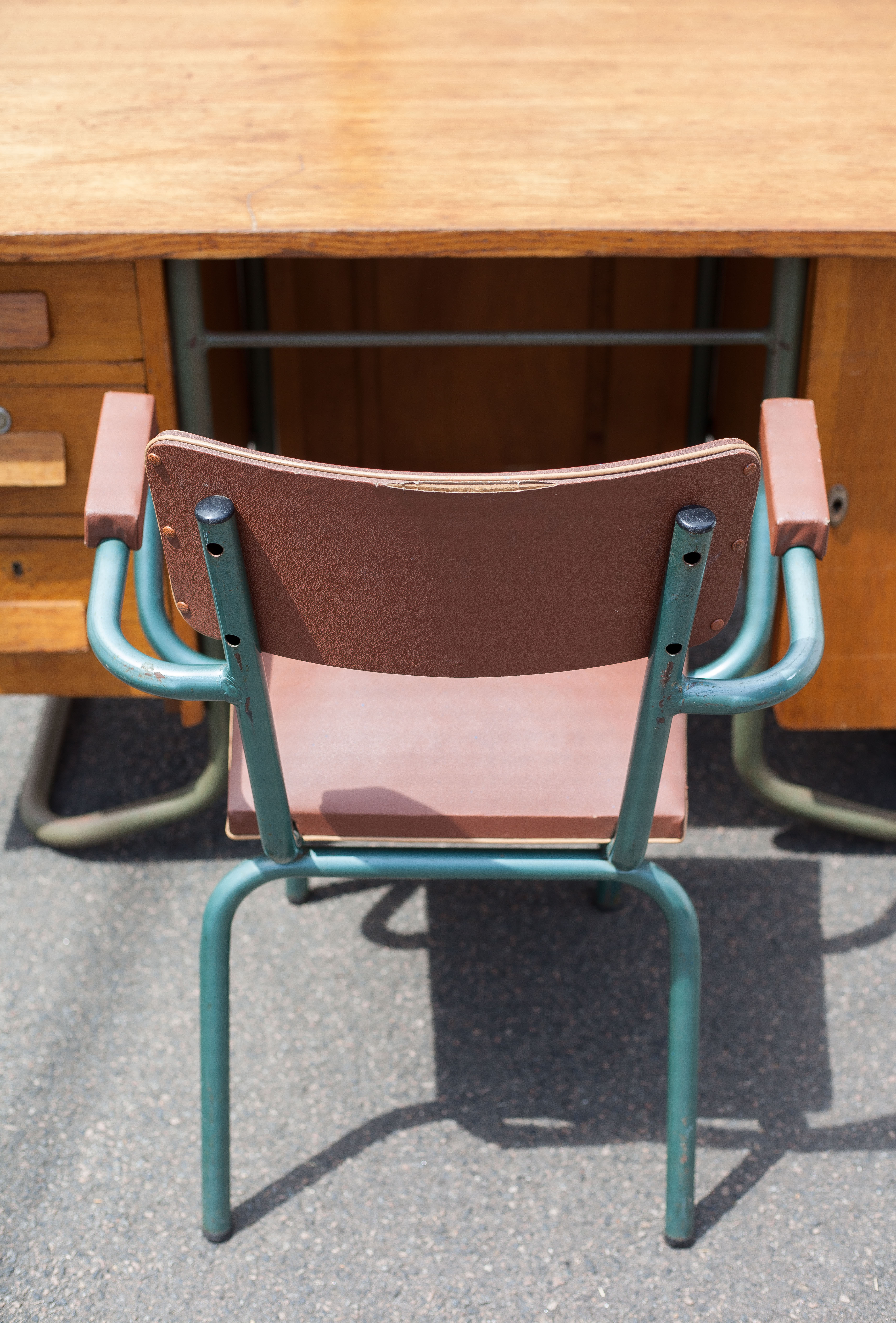School teacher's chair in imitation leather and tubular metal