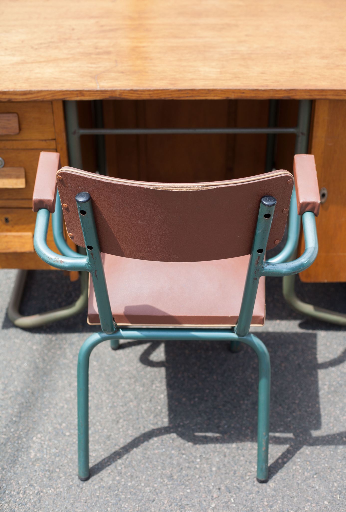 School teacher's chair in imitation leather and tubular metal