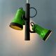 Vintage pendant light with three green spots.