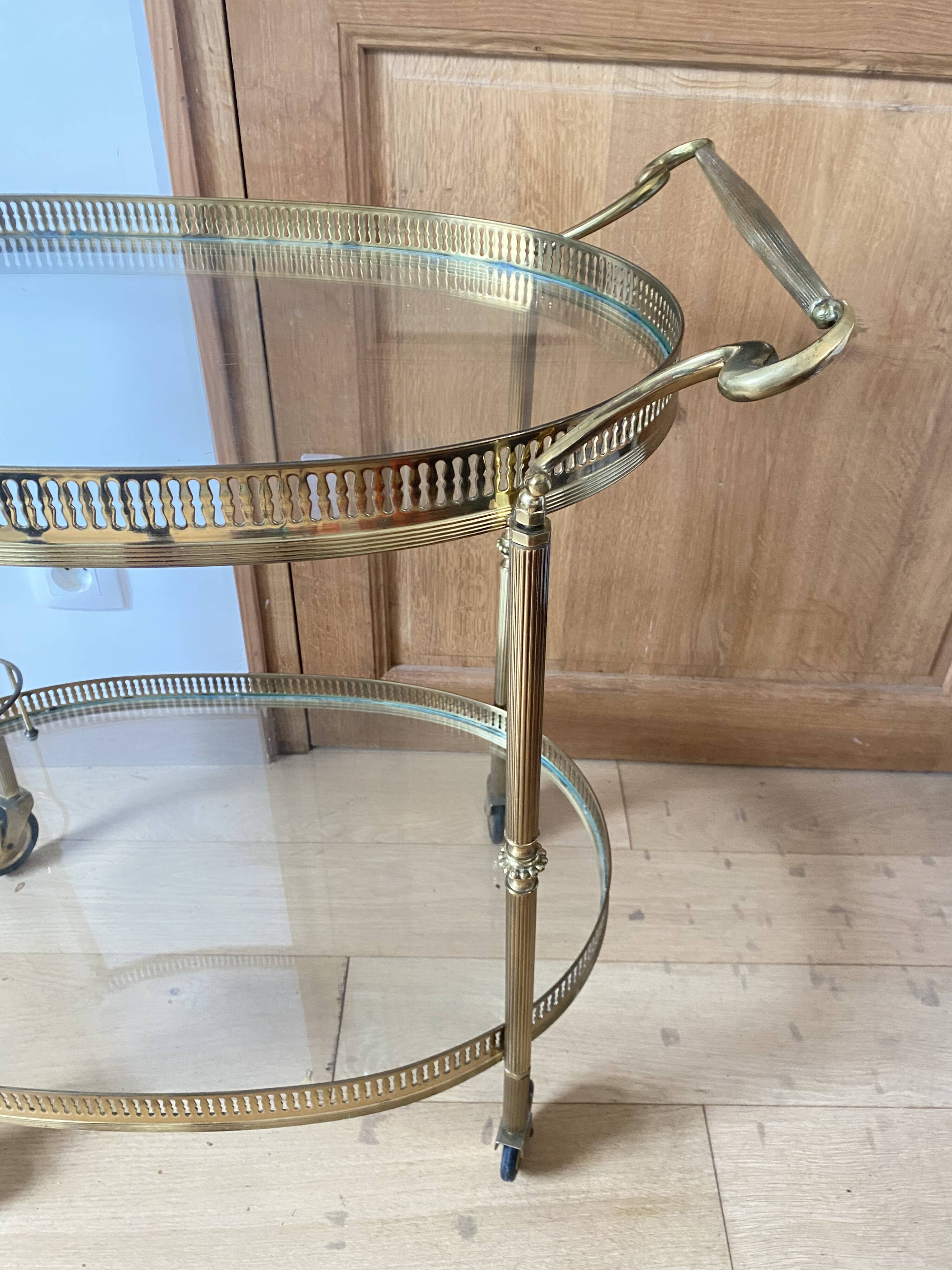 Oval golden brass rolling dessert trolley, Maison Jansen style, 1960s.
