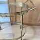 Oval golden brass rolling dessert trolley, Maison Jansen style, 1960s.