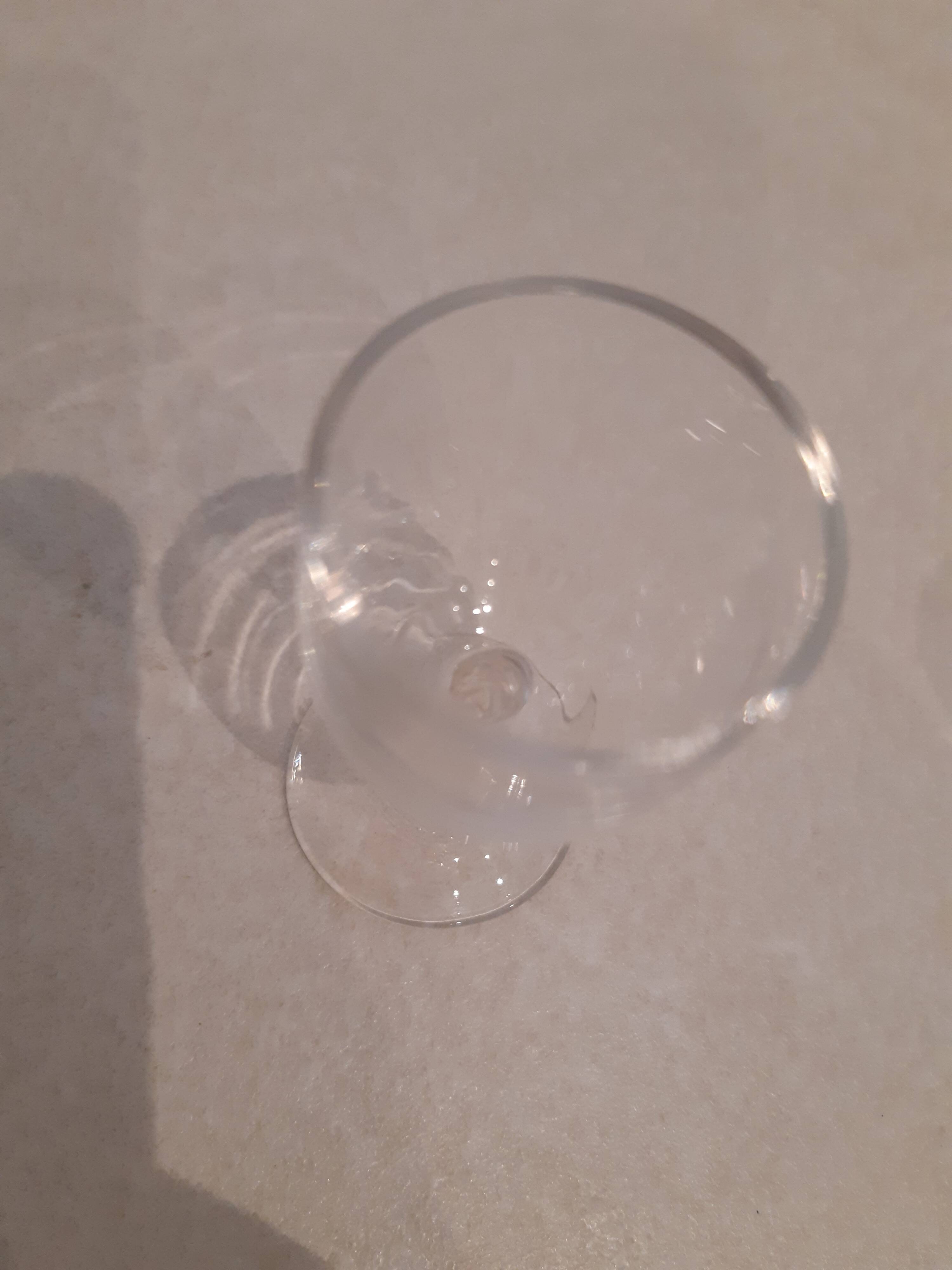 Set of 4 small stemmed glasses for strong alcohol.