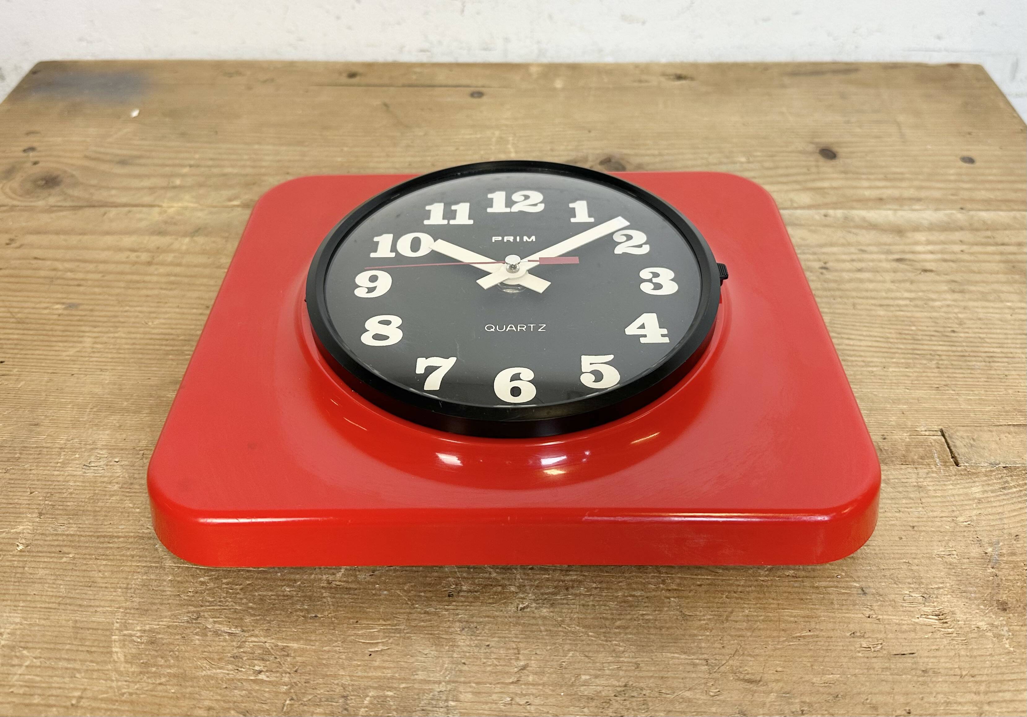Vintage red bakelite wall clock from prim, 1970s