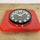 Vintage red bakelite wall clock from prim, 1970s