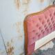 antique wooden and fabric headboard