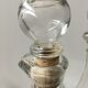 Lot of 2 old glass and tin condiment service bottles and corks