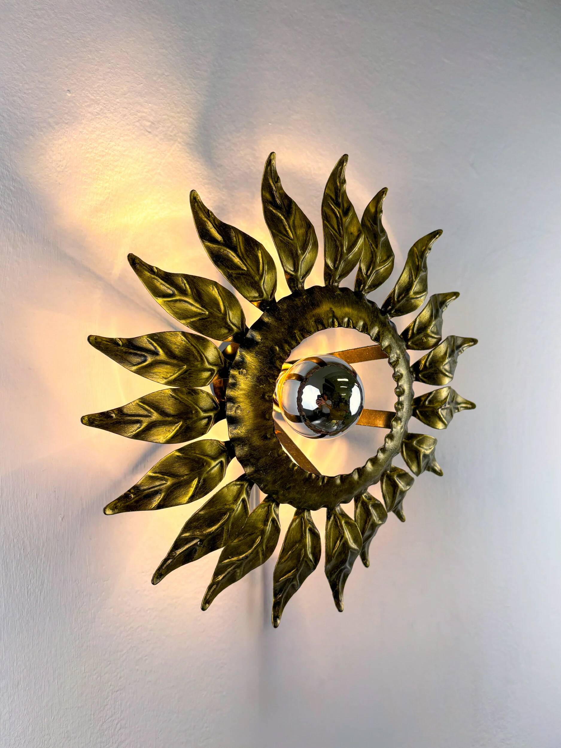 Sunburst ceiling light fixture or sconce in gilt wrought iron, Spain, circa 1960s