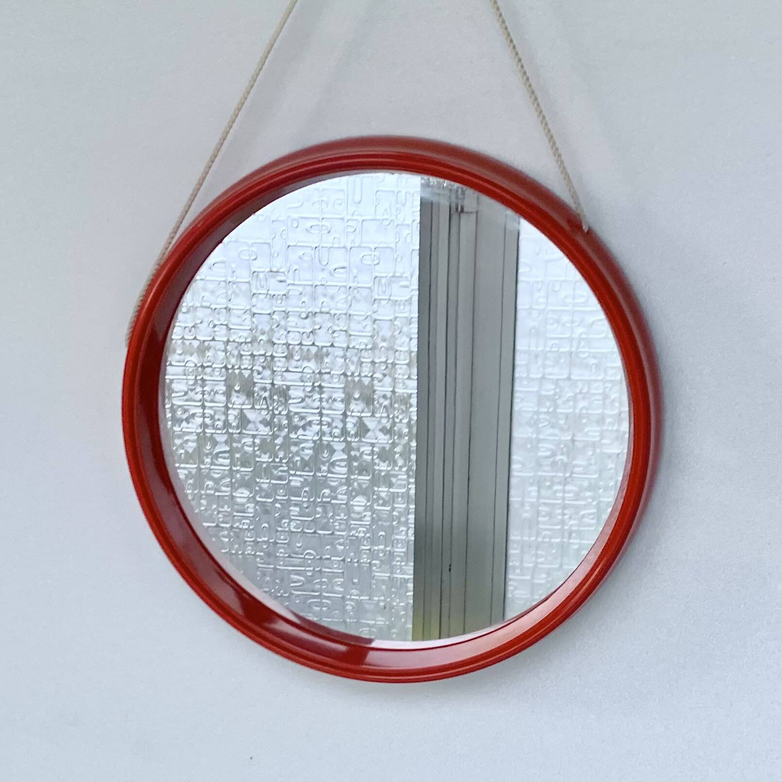 Pair of vintage round red plastic mirrors