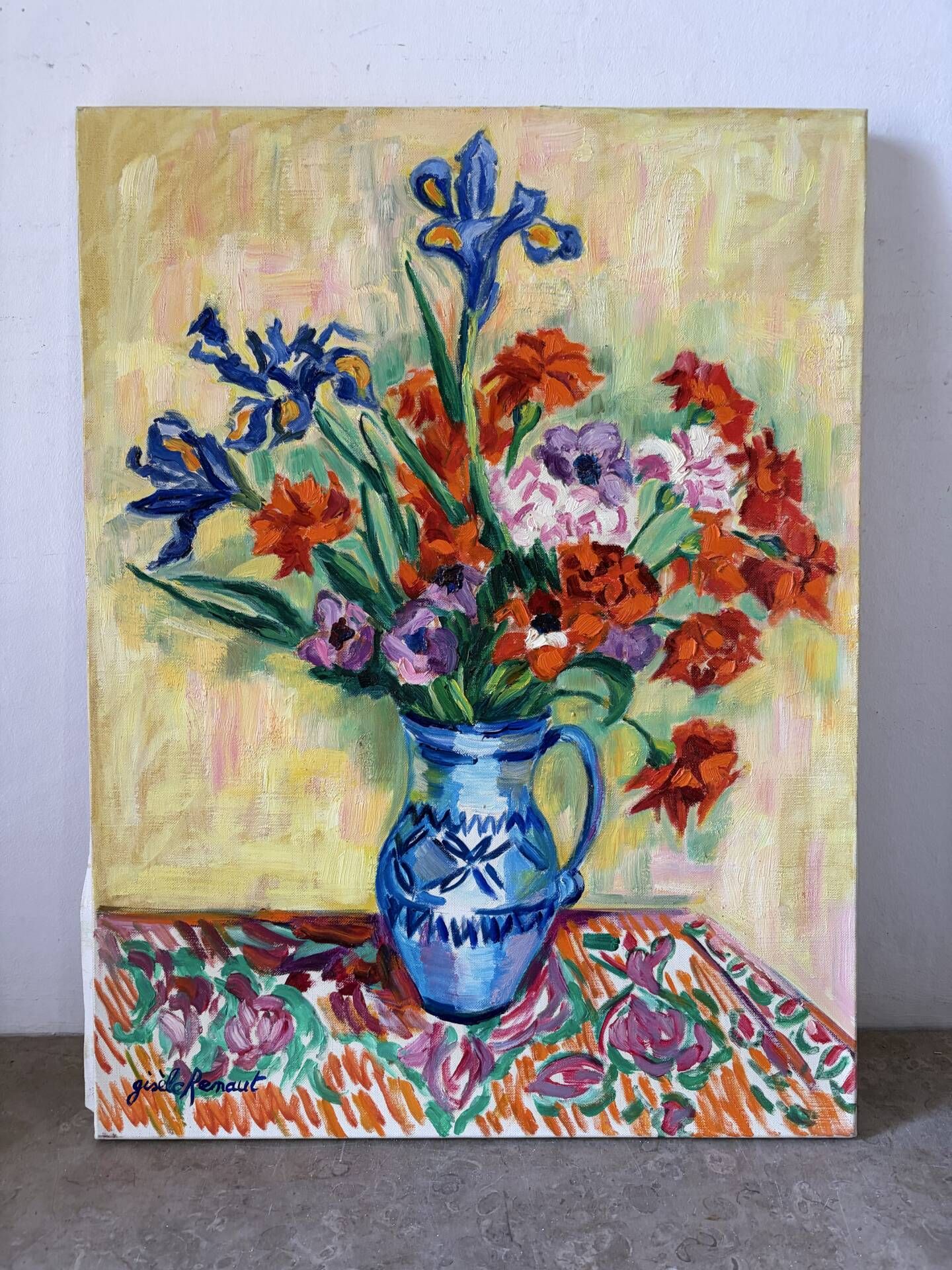 Iris and orange carnations, oil on canvas signed Gisèle Renaut.