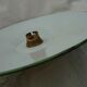 Old suspension in green enamelled sheet metal and brass socket to hang