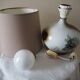Glazed ceramic ball lamp signed Bossis with a fabric shade.