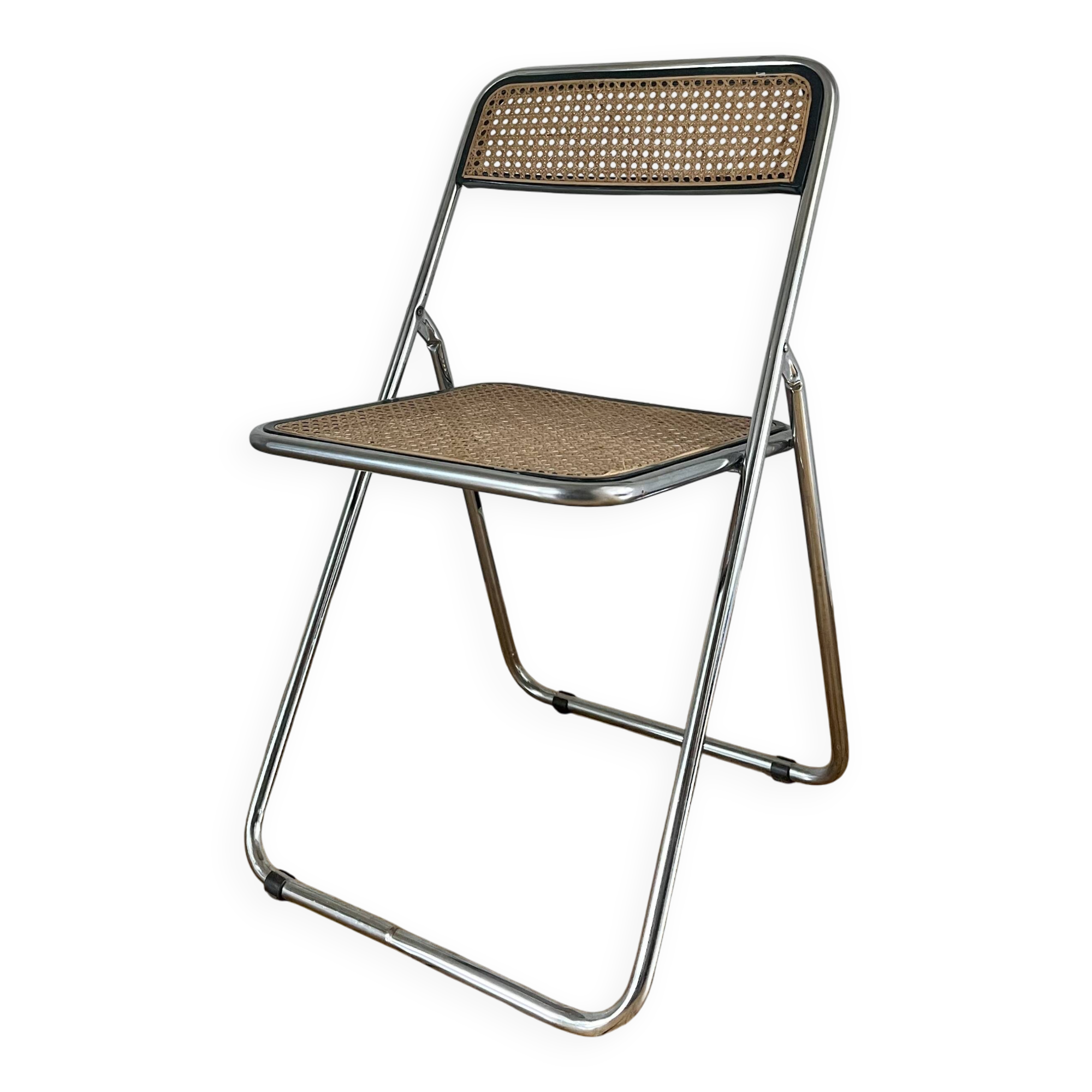 Vintage folding chair in metal and cane.