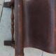 Vintage magazine rack in oak and antique leather