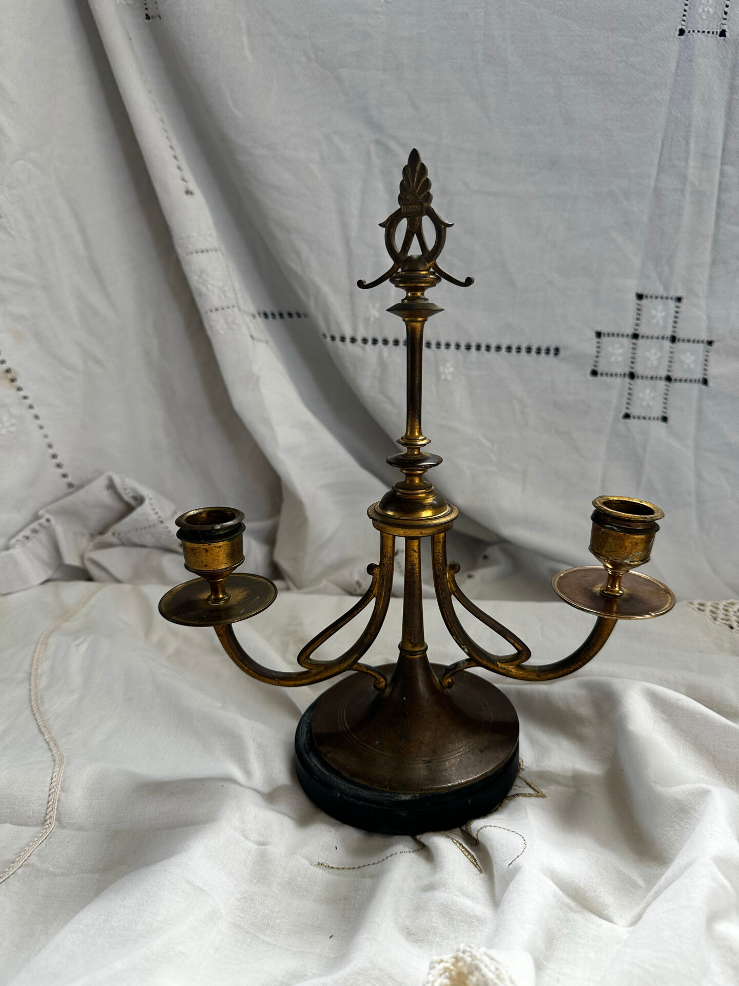 Pair of Empire style candlesticks, patinated brass and black stone.
