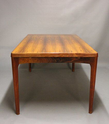 Teak dining table designed by Henning Kjaernulf and manufactured 60 years