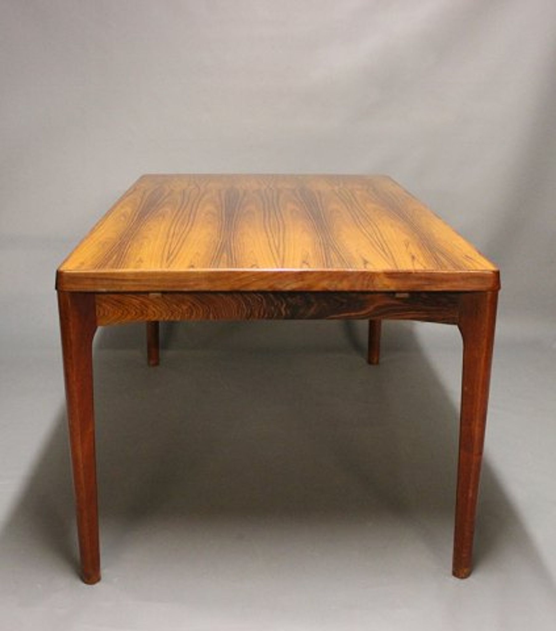 Teak dining table designed by Henning Kjaernulf and manufactured 60 years