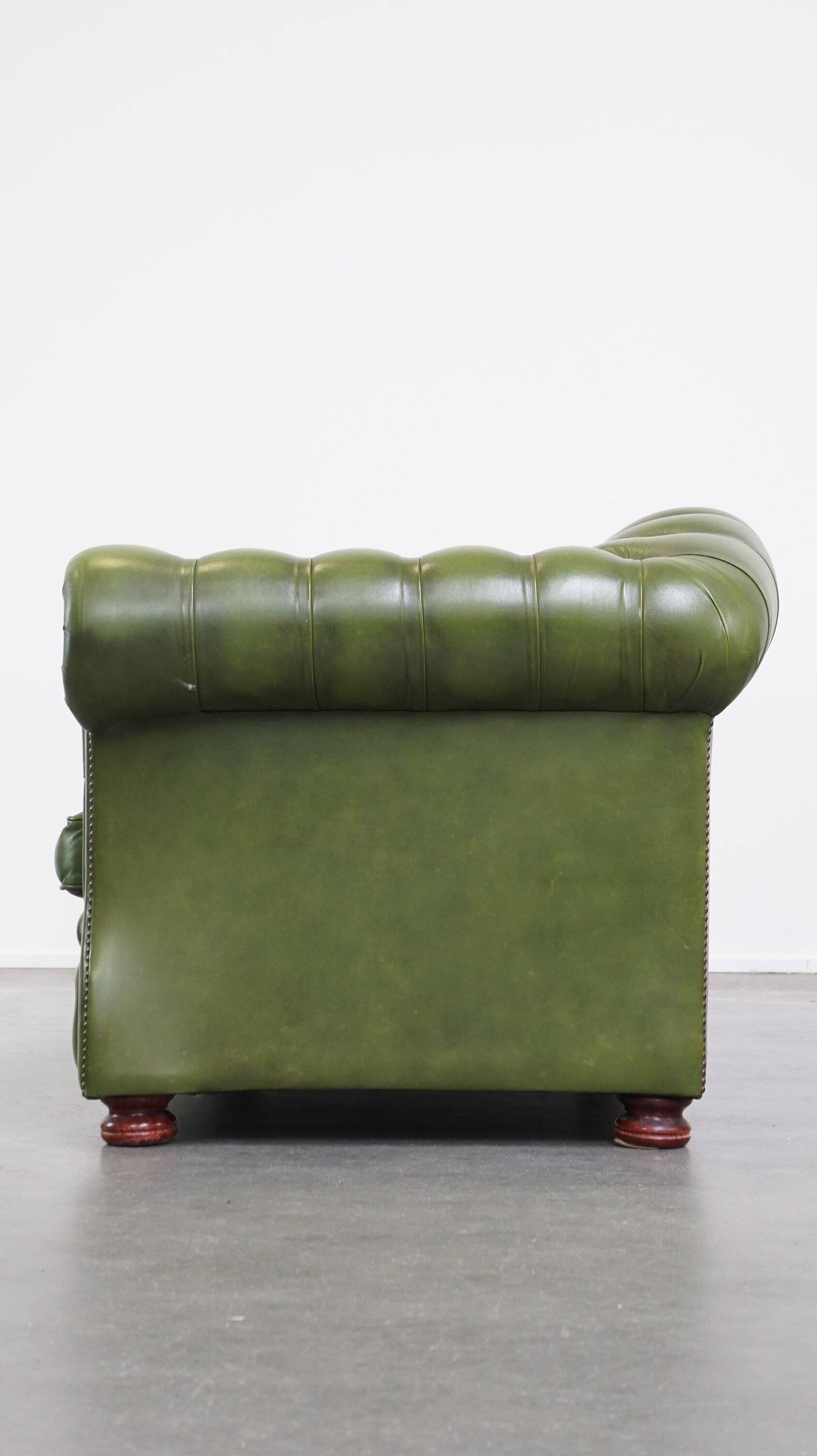 Stylish, English green cow leather spacious 2.5 seater chesterfield sofa