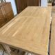 Solid oak extendable farmhouse table with 2 drawers.