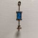 Wall-mounted candle holder in cast iron and hard pressed blue glass.