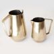 Duo of bronze pitchers