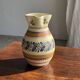 Beige carafe with stylized blue flower friezes