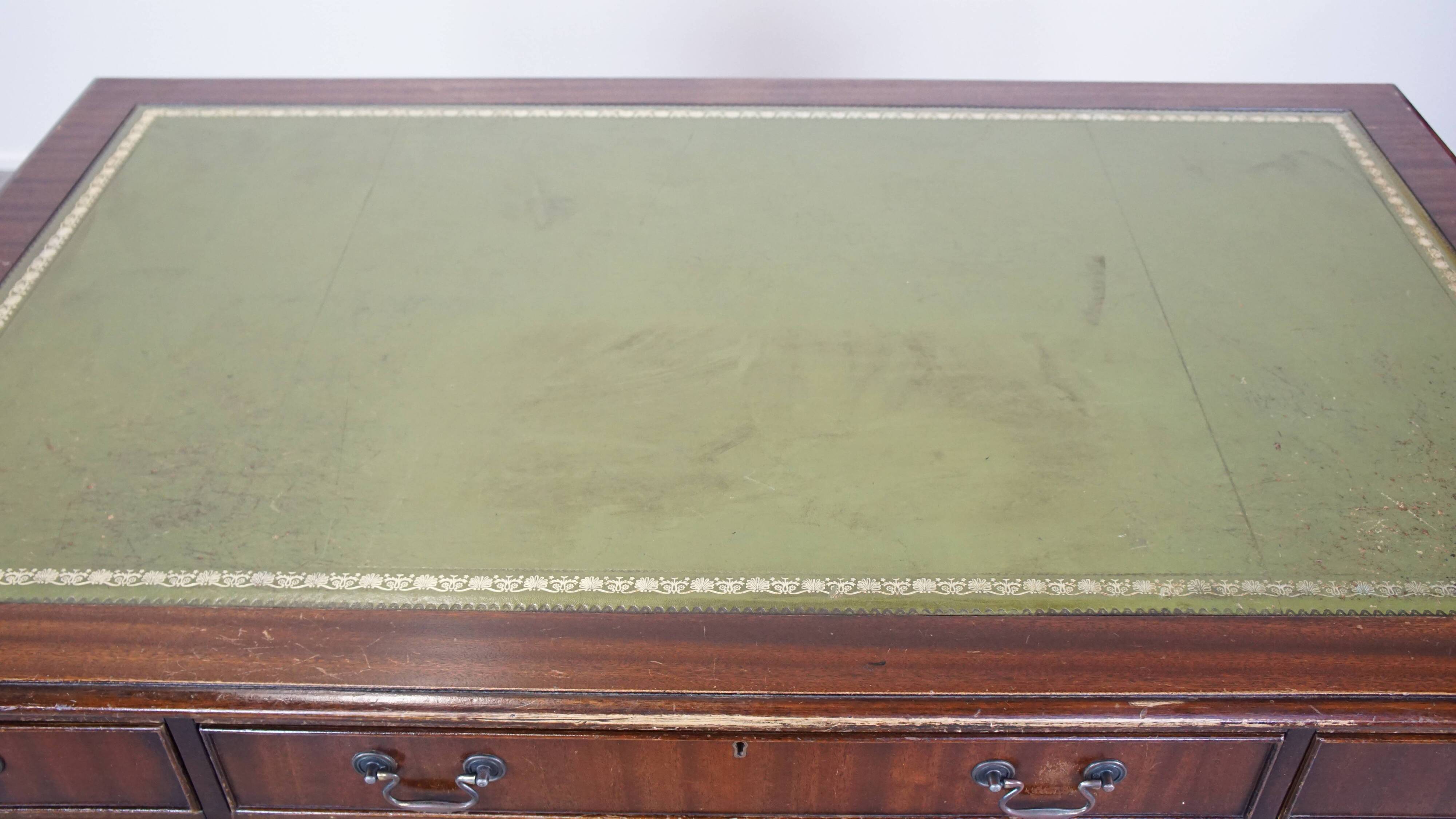 English style chesterfield desk with patina and a green leather top