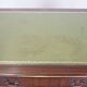 English style chesterfield desk with patina and a green leather top