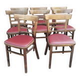 Set of 8 bistro chairs in vintage red wood and leatherette.