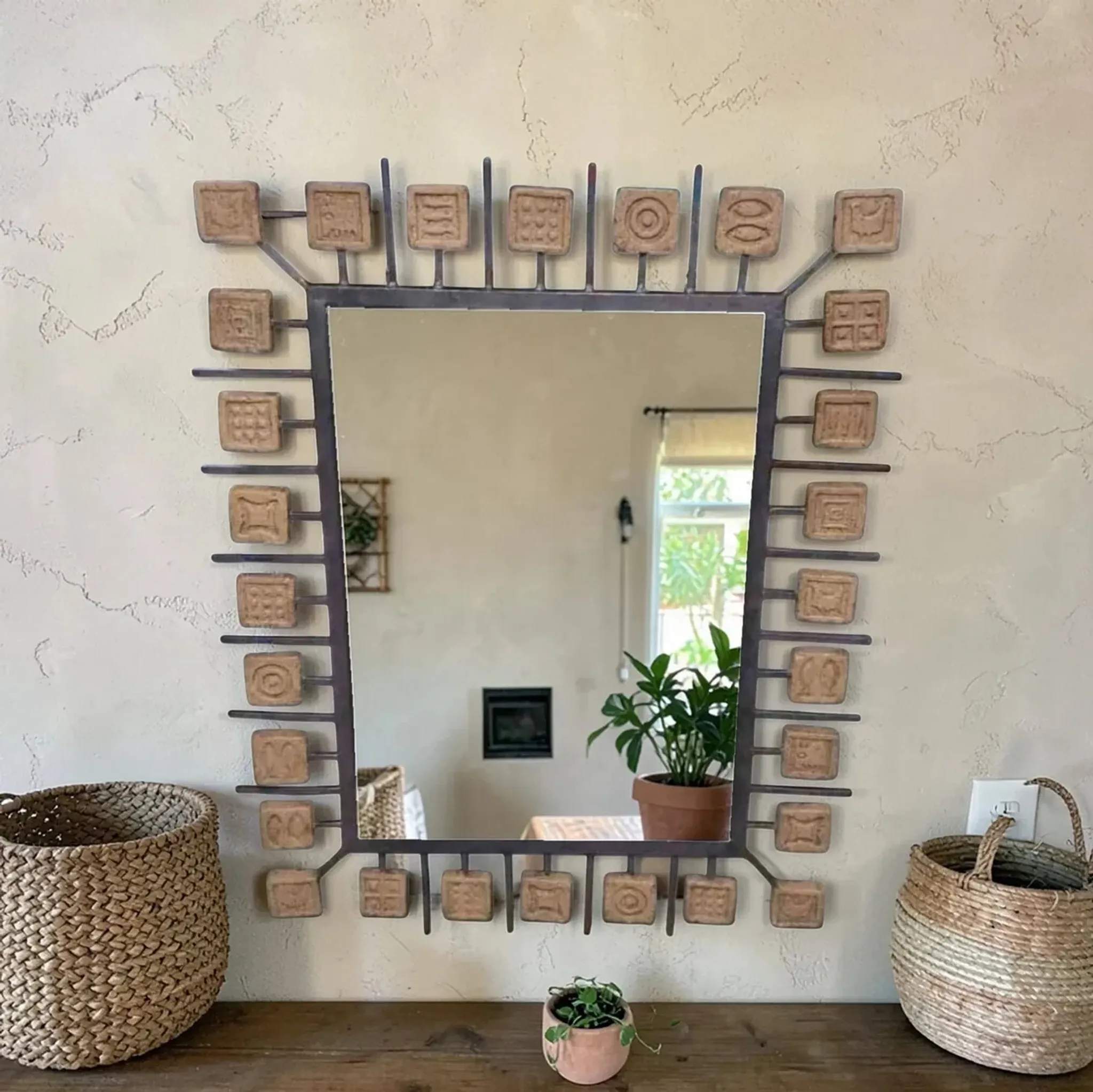 Rectangular brutalist mirror in wrought iron and terracotta tiles.