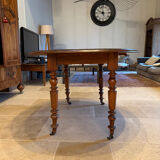 Oval drop-leaf table