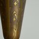 Art Deco fluted vase in patinated metal and brass from the 1930s.