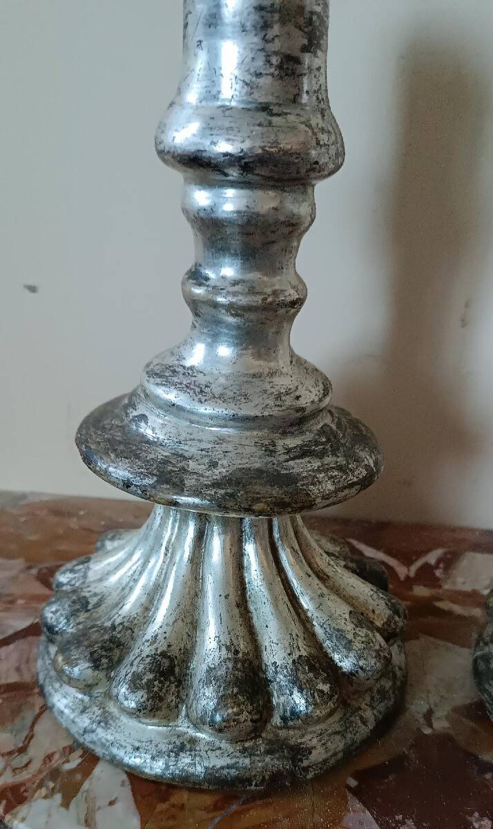 Rare pair of antique silvered terracotta candlesticks from the 17th century.