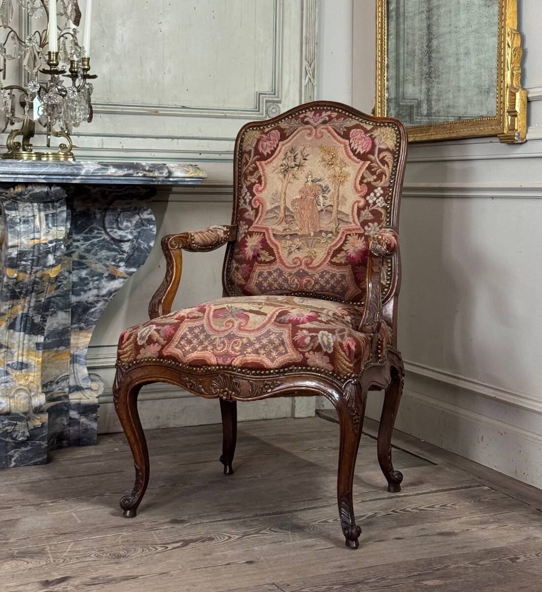 Louis XV armchair in carved walnut, needlepoint tapestry, 18th century