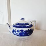 Small porcelain teapot or milk jug with the famous blue willow or weeping pattern