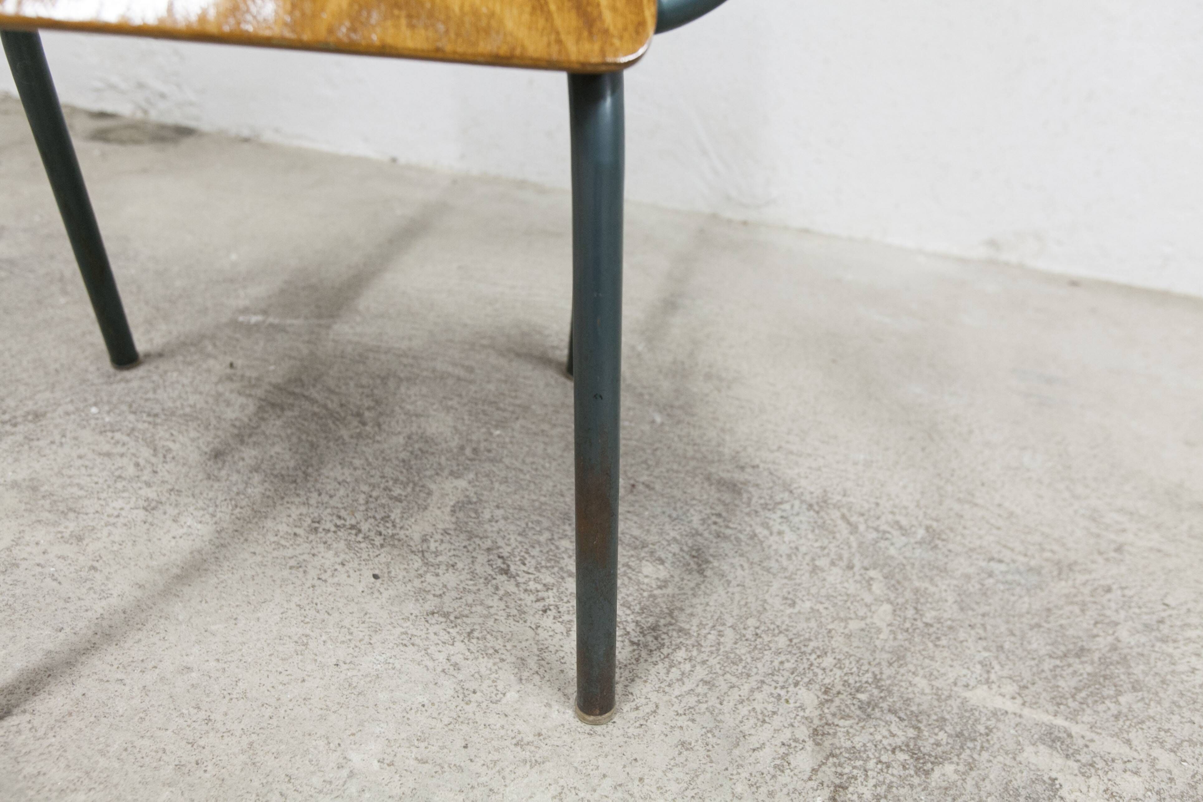 1962 school teacher's chair in honey color and tubular structure