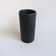 Matte black cylinder vase by Antonio Lampecco