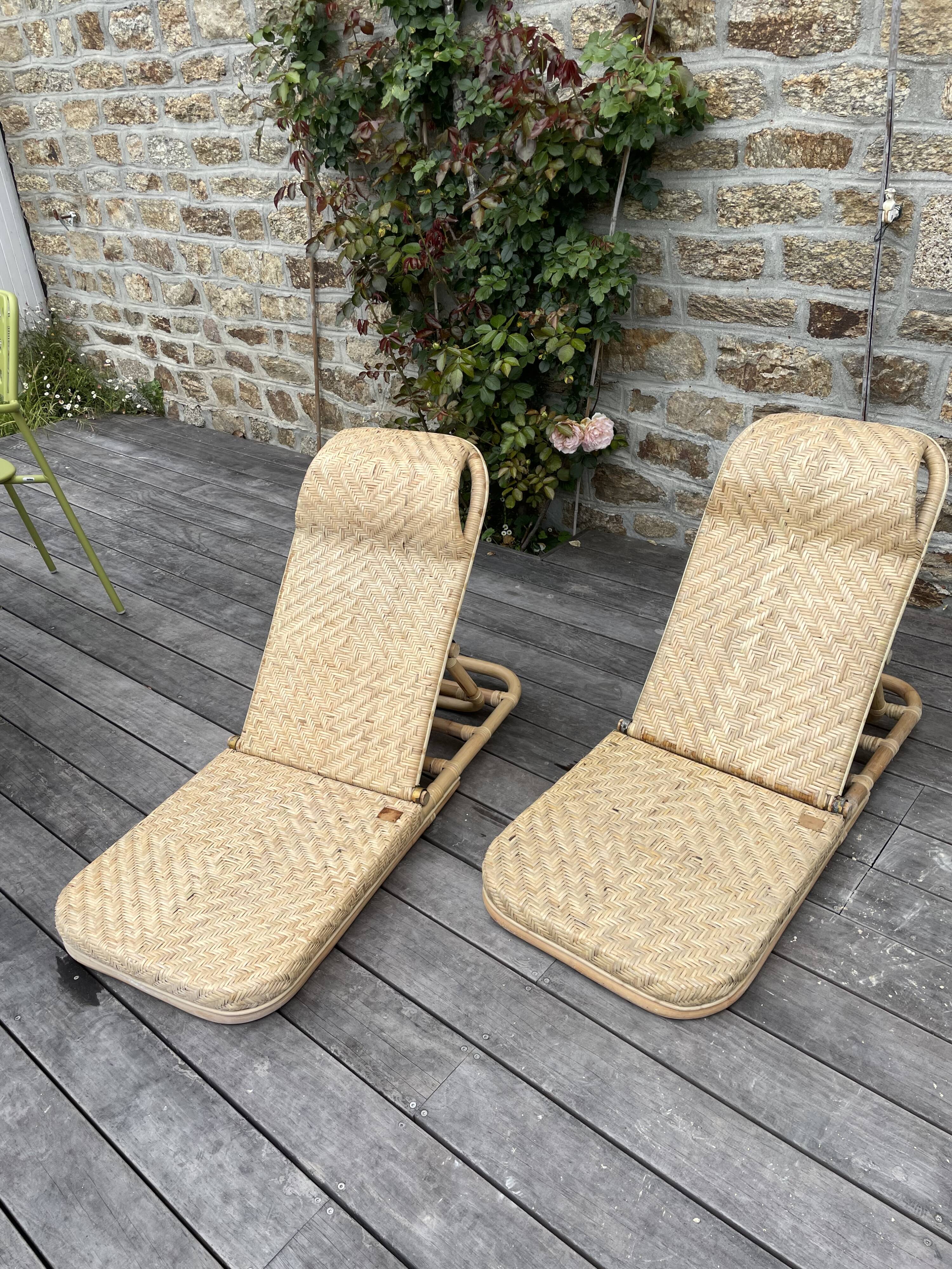 Two rattan garden chairs