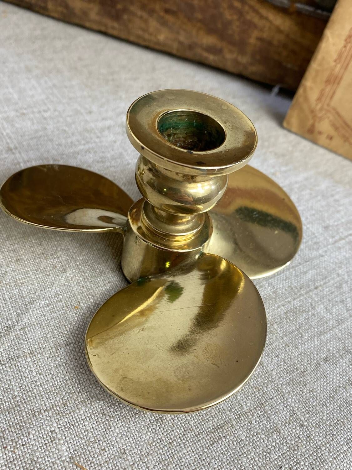 Pair of vintage brass propeller-shaped candlesticks