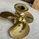 Pair of vintage brass propeller-shaped candlesticks