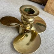 Pair of vintage brass propeller-shaped candlesticks