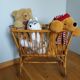 Rattan wicker cradle on wooden wheels