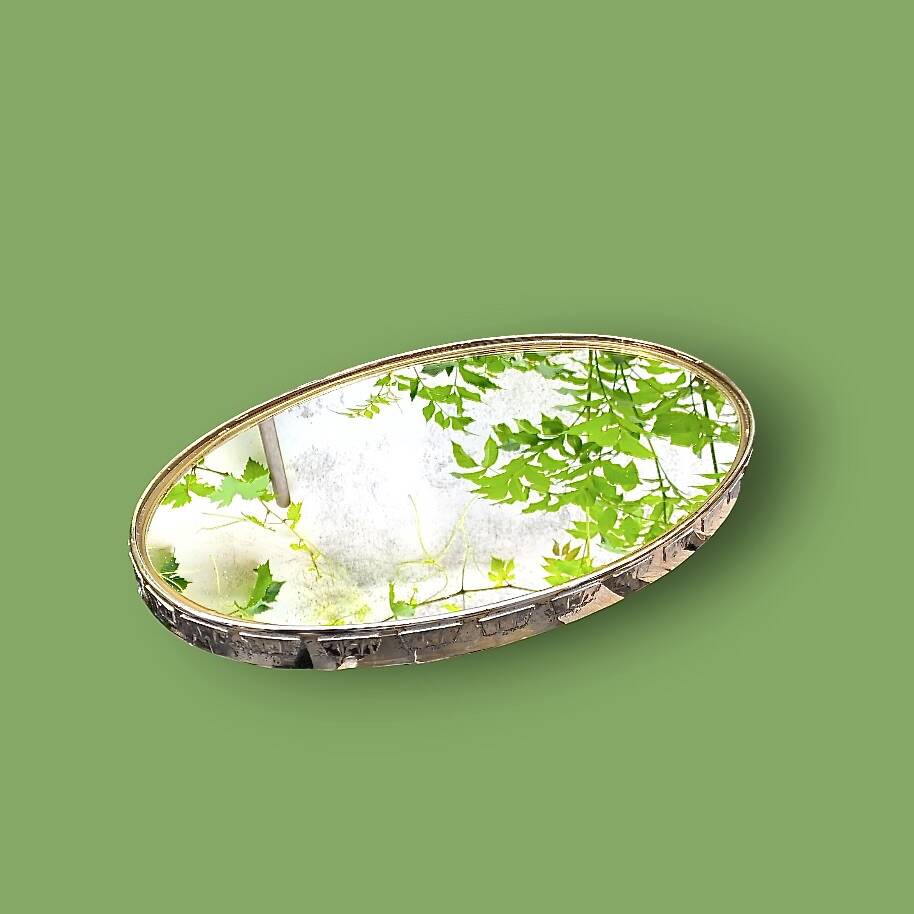 Large antique oval wall mirror in stylized gilt metal, – Hollywood Regency