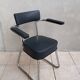 Vintage office chair in chrome metal and faux leather.