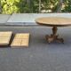 Round dining table with a central pedestal, stripped raw oak, 4 extensions, 19th century.