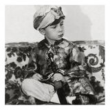 Photograph of a boy with a houka