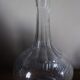 Glass carafe with round neck and fluted bellies