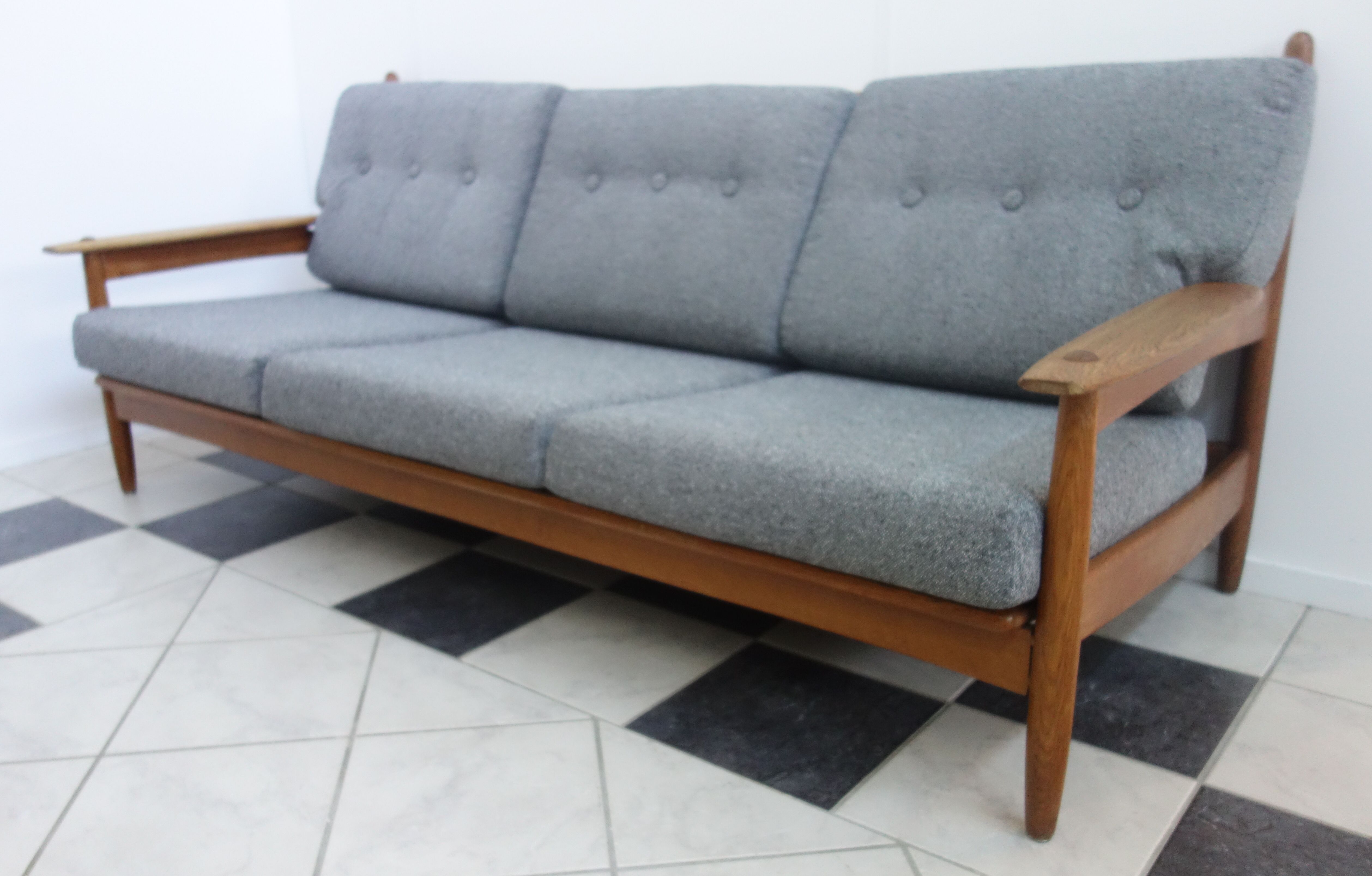 Three seater sofa in fabric and wood