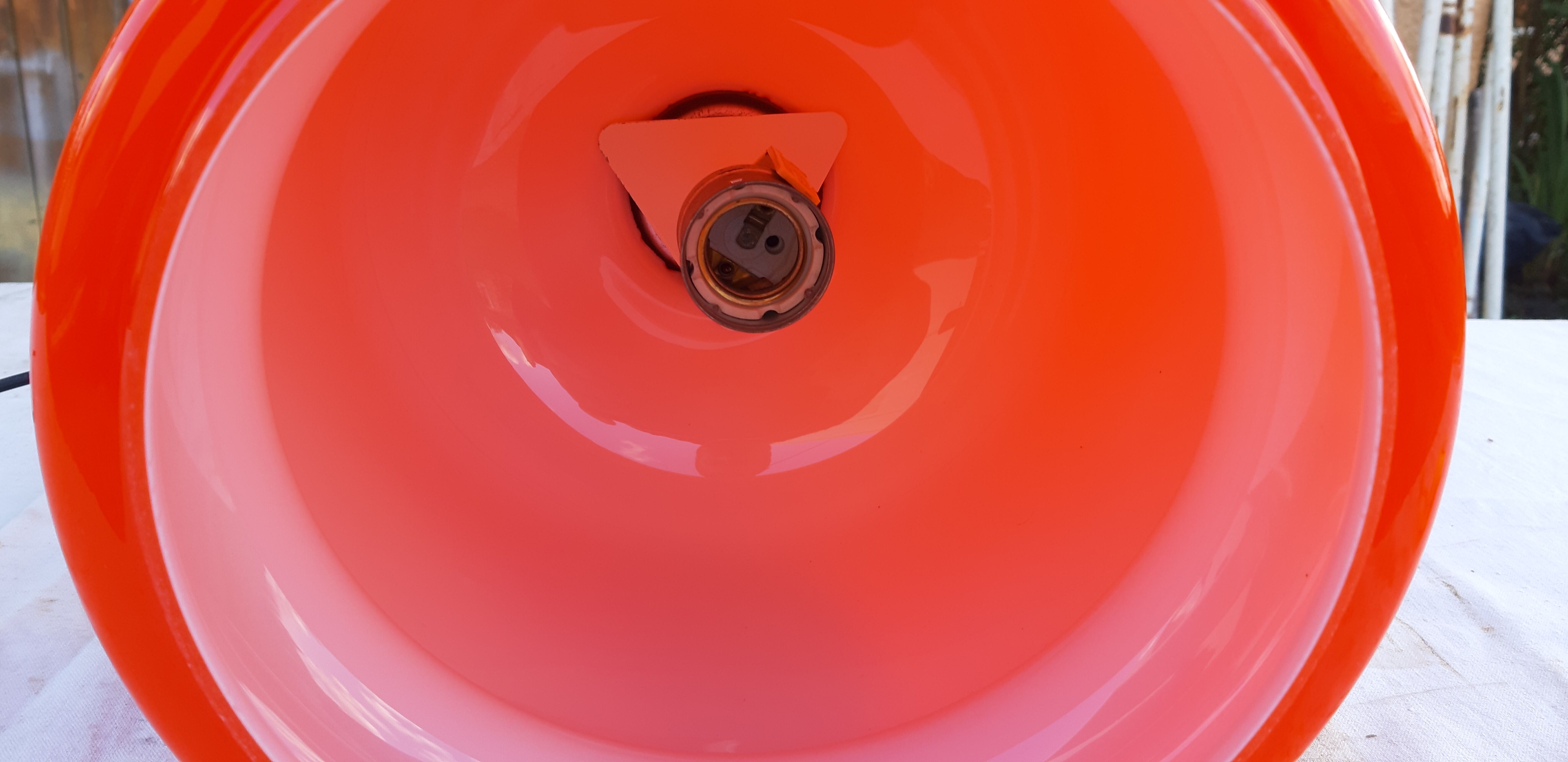 Vintage lamp of the 70s in orange opaline