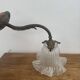 Antique bronze wall light in Louis XVI style - tulip-shaped glass paste flower.