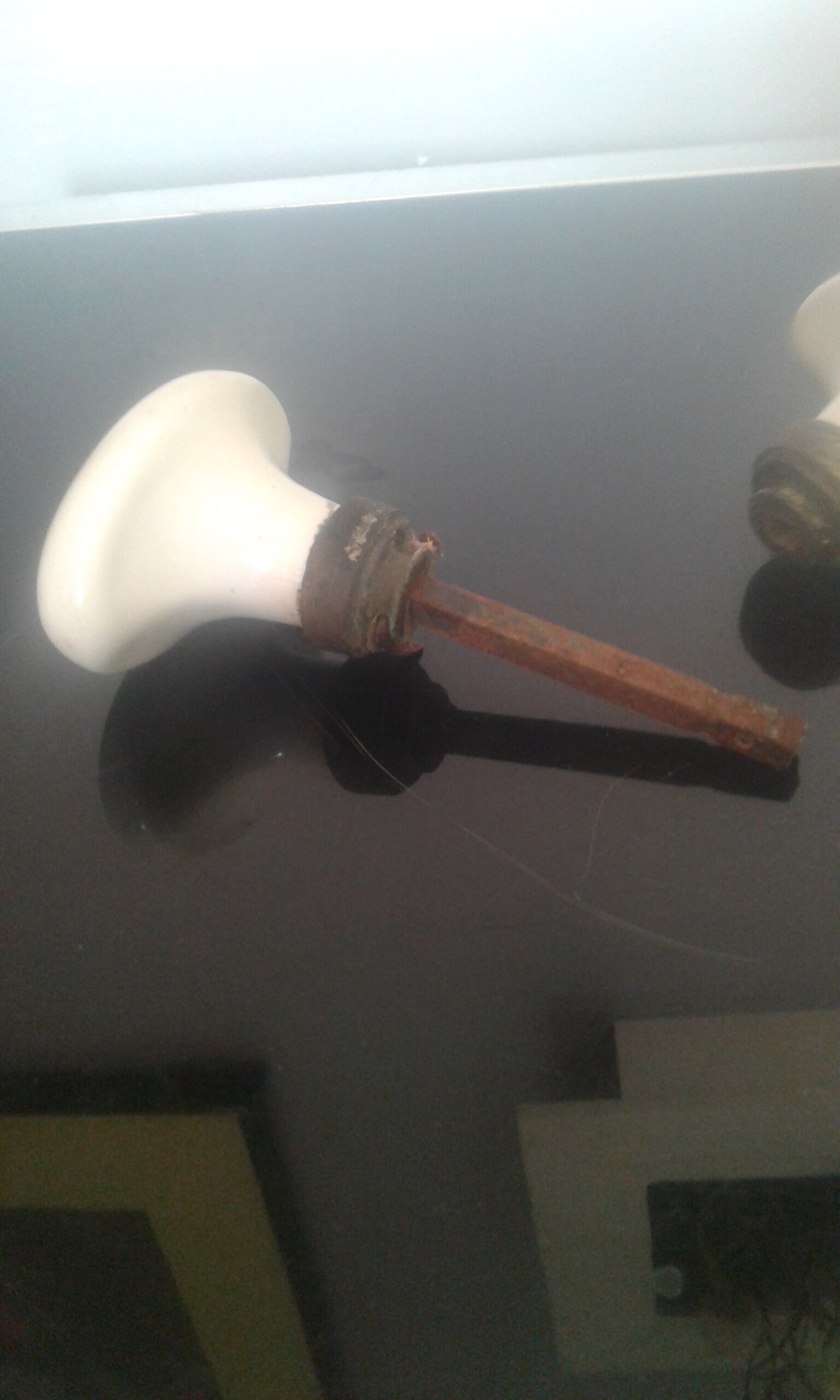 Old pair of porcelain door handles